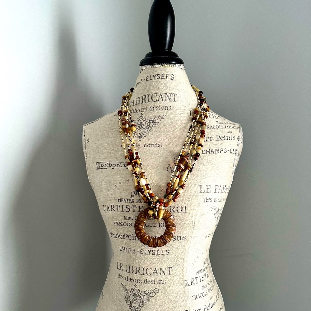 Neutral colors long necklace.